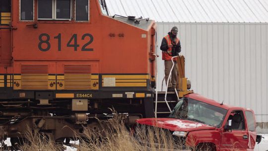 Pickup-train collision results in minor injuries