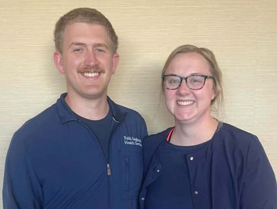 Jared and Grace Bessmer wear the nursing scrubs they earned through classes at Northeast