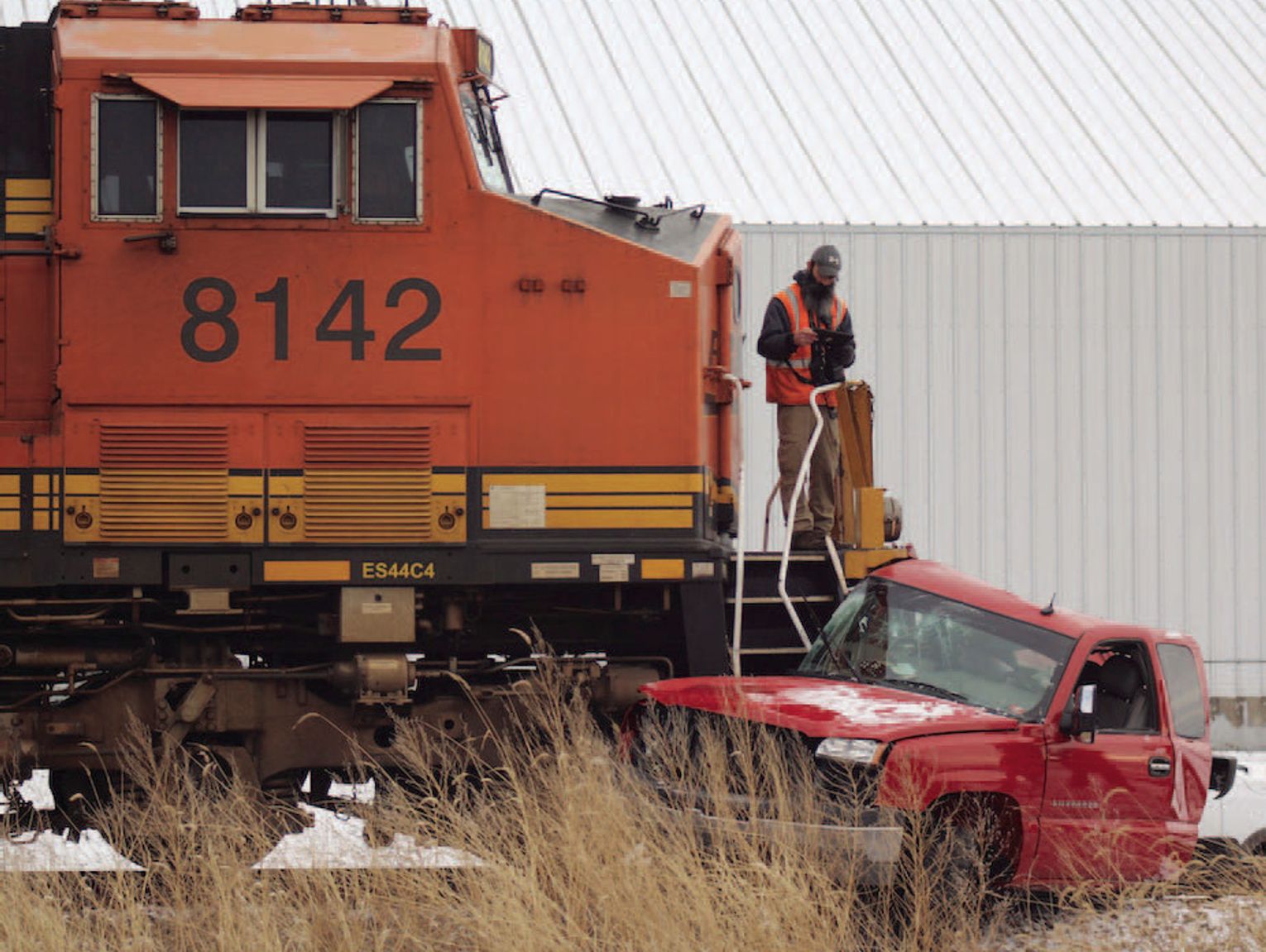 Pickup-train collision results in minor injuries
