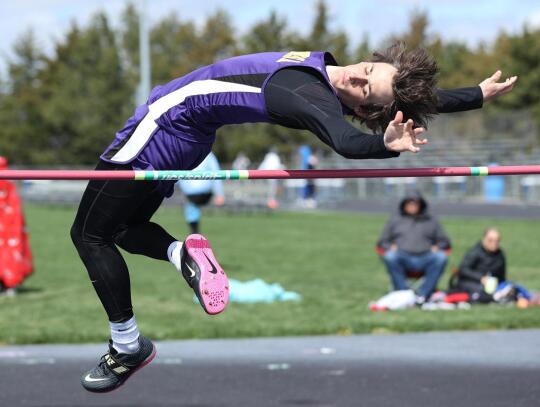 Matthew Schindler spots his landing as he goes up and over the bar during the high jump. Jeremy Buss | Wausa Gazette