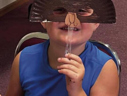 SUMMER READING, SUMMER FUN — The Summer Reading Program has been going on each Tuesday morning in June, with the theme, “Adventure Begins at the Library.” The children read stories, play games and do activities. In the top photo, Klaire Johnson help